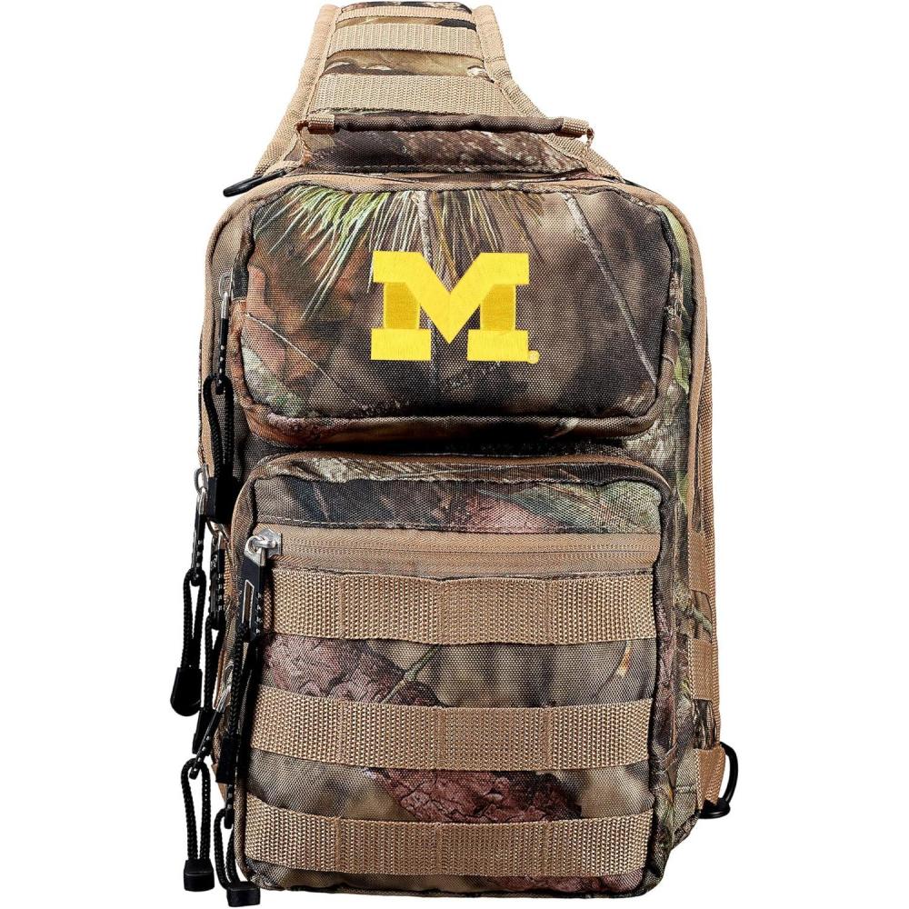 imageOfficially Licensed NCAA quotFlyoverquot Tactical Slingpack 12quot Mossy OakMichigan Wolverines