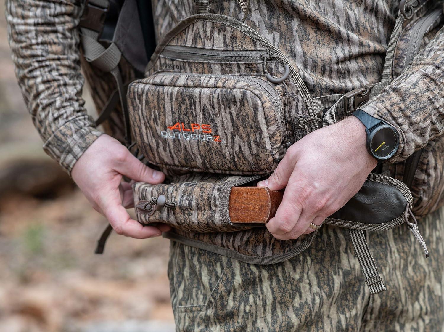 imageALPS OutdoorZ Impact Camo Turkey Vest with Removable Flip Down Seat Game Bag and Plenty of Pockets for Calls and StrikersMossy Oak Bottomland