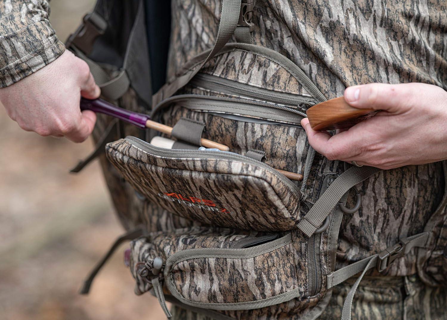 imageALPS OutdoorZ Impact Camo Turkey Vest with Removable Flip Down Seat Game Bag and Plenty of Pockets for Calls and StrikersMossy Oak Bottomland
