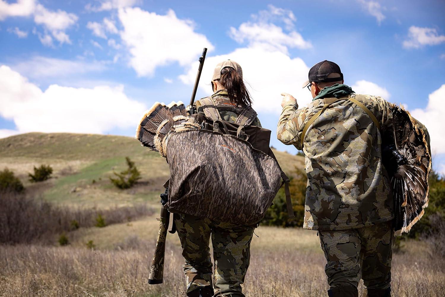 imageALPS OutdoorZ Impact Camo Turkey Vest with Removable Flip Down Seat Game Bag and Plenty of Pockets for Calls and StrikersMossy Oak Bottomland