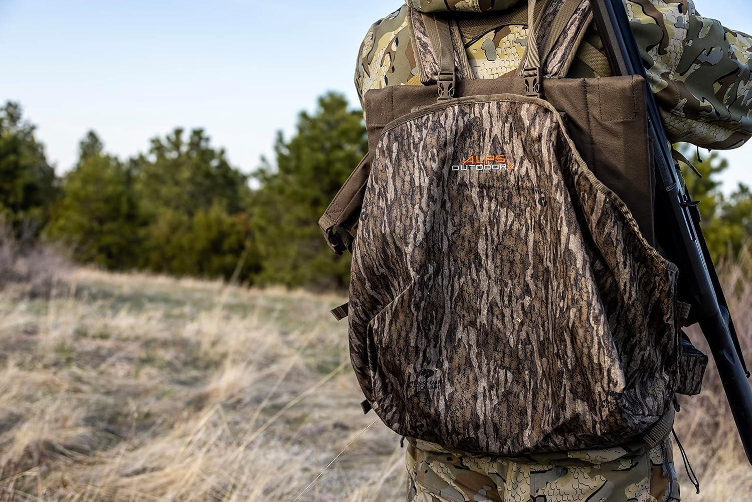 imageALPS OutdoorZ Impact Camo Turkey Vest with Removable Flip Down Seat Game Bag and Plenty of Pockets for Calls and StrikersMossy Oak Obsession